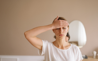 A woman experiencing exhaustion and mental fatigue.