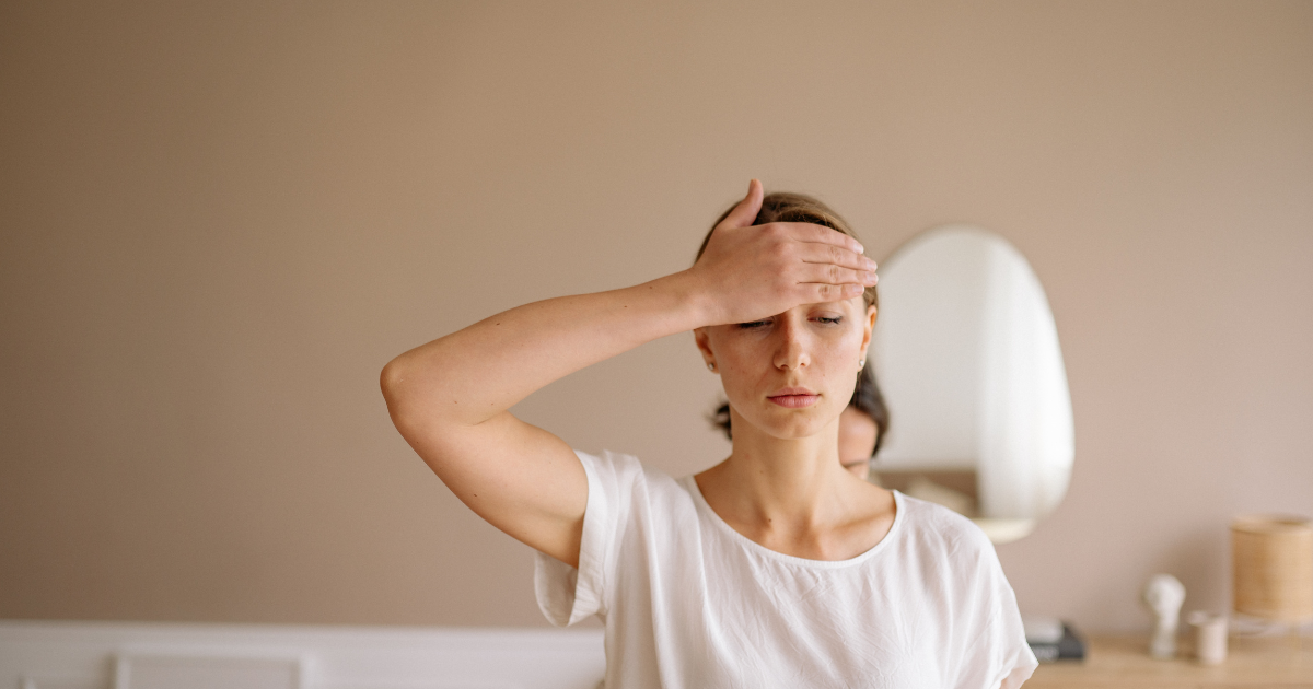 A woman experiencing exhaustion and mental fatigue.
